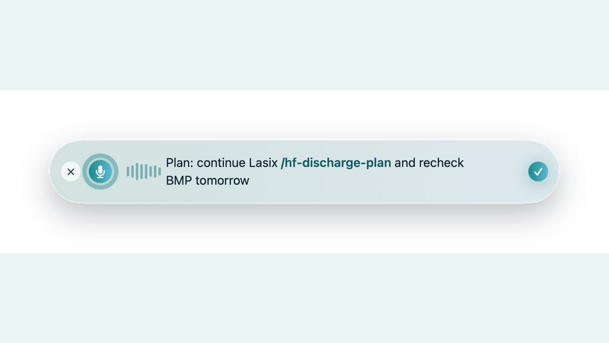 The Glass Island dropping a saved Dot Phrase into a dictated sentence.
